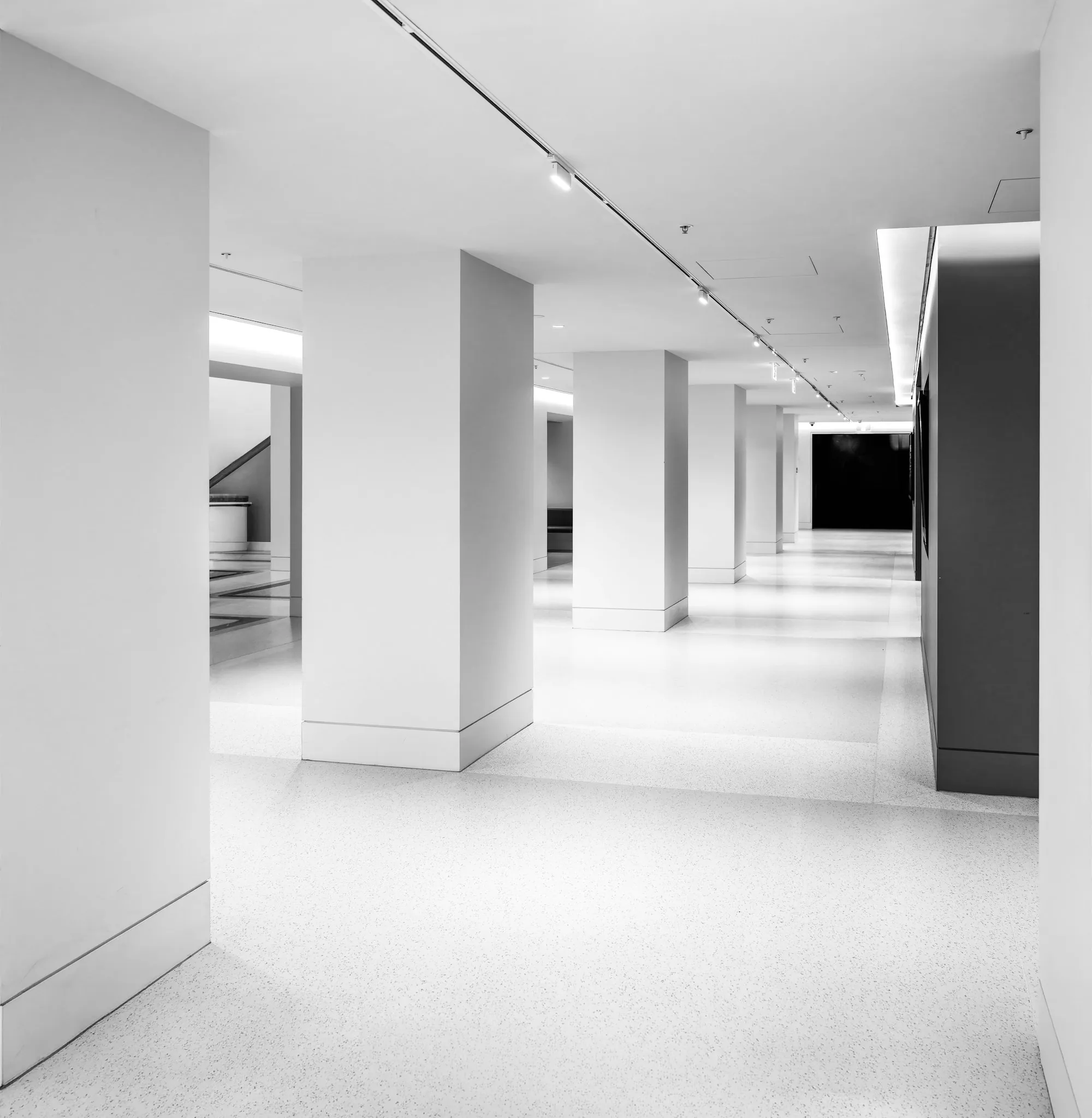 Empty white office floor with polished tiles